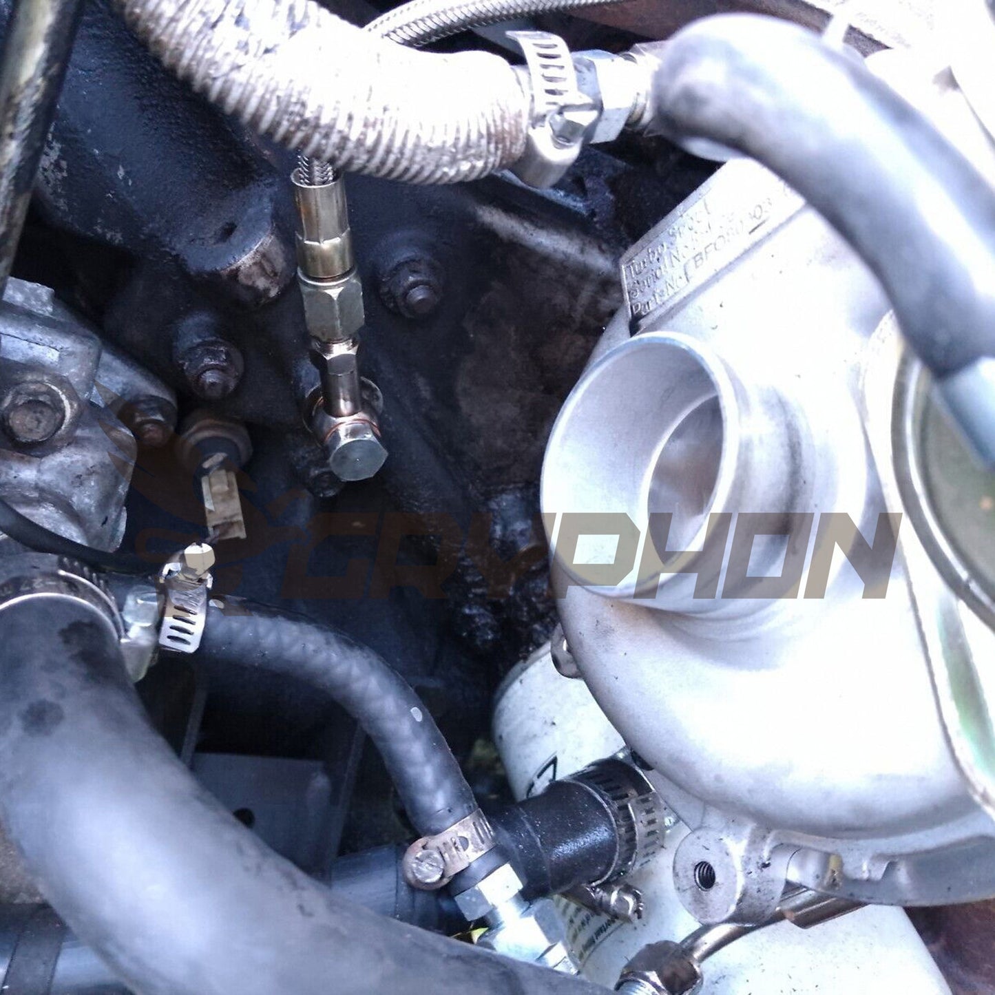 Installed braided PTFE oil feed line kit on Mazda B2500 WL-T 2.5L turbo engine.