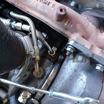 Installed braided PTFE oil feed line kit on Mazda B2500 WL-T 2.5L turbo engine.