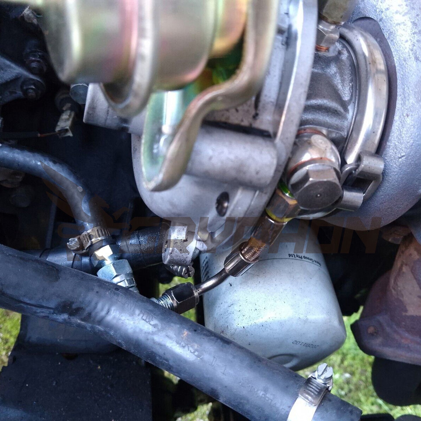 Installed braided PTFE water line kit on Mazda B2500 WL-T 2.5L turbo engine.