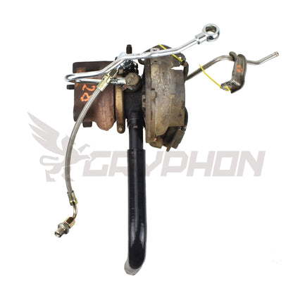 Complete turbo oil feed and return line kit for Nissan YD25DDTI with RHF4 VN4 turbocharger, includes 4AN PTFE stainless braided feed line, silicone drain hose, 6061-T6 flange, gasket, and fittings.