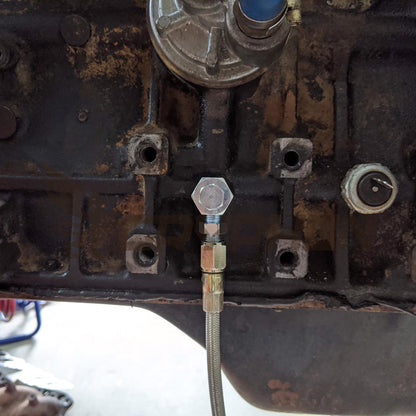 Installation view of oil feed T-fitting connected to Toyota 22R 22RE engine